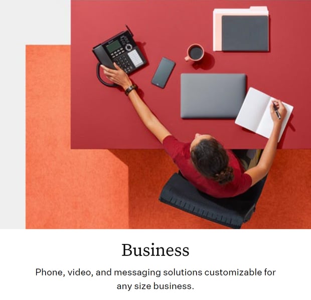 Ooma woman working at desk using top voip for small business