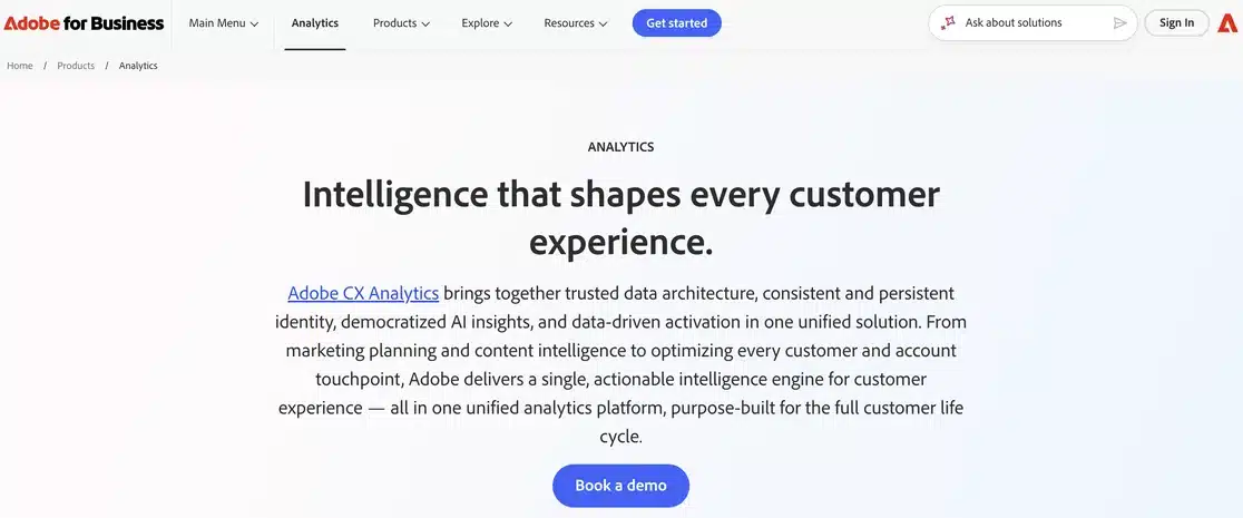 Adobe Analytics product page with the headline Intelligence that shapes every customer experience, an introduction to Adobe CX Analytics and a Book a demo button